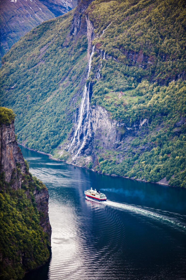 Geirangerfjord with a waterfall and a ship on the water
