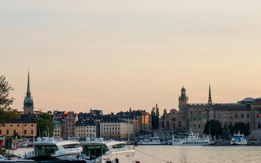 Stockholm harbour with boats and church spires on the skyline