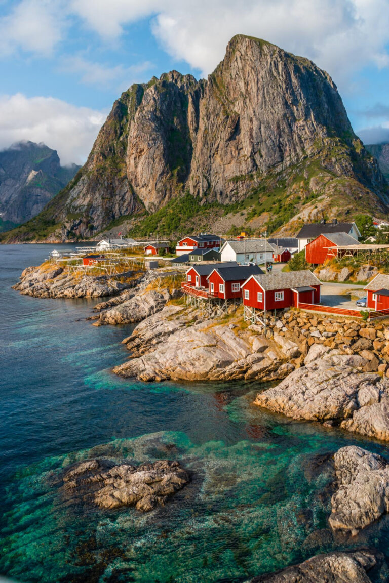 Red fishing cabins and mountains on the Norwegian coast